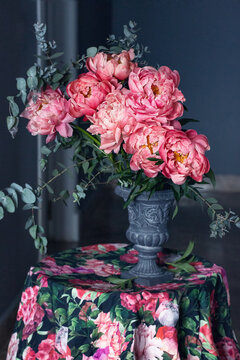 Beautiful bouquet of flowers. Close-up floral composition with a pink peonies on a dark background.