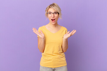 young pretty woman amazed, shocked and astonished with an unbelievable surprise