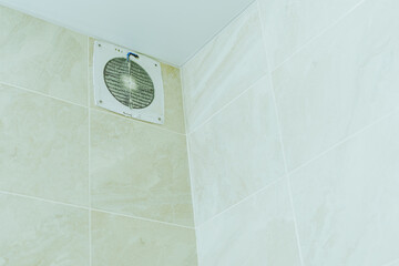 Air extractor clogged with dust in the bathroom