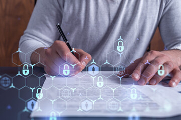 A businessman in casual wear signing the contract to prevent probability of risks in cyber...
