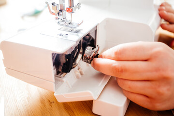 Putting the metal spool into sewing machine