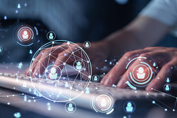 Hands of hr specialist is typing the keyboard in the internet to find the best candidates to create...