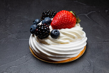 The Pavlov dessert with white cream and fruits