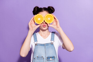 Photo of funny brown hair lady cover eyes oranges wear t-shirt overall isolated on violet background