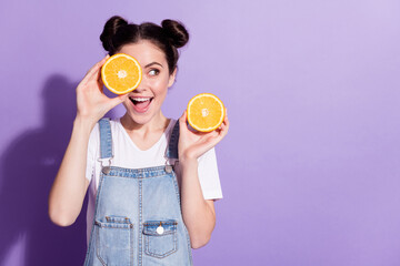 Photo of young excited girl happy positive smile close cover eye orange look empty space isolated over violet color background