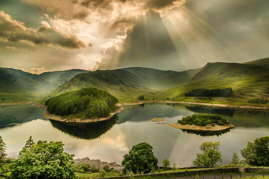 Sun Rays Bursting Through Storm Clouds, The Lake District, Cumbria, England	