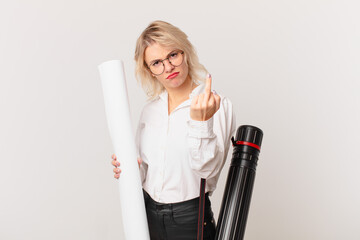 young pretty woman feeling angry, annoyed, rebellious and aggressive. architect concept
