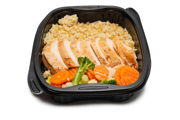 Ready food in a container. Stewed chicken, stewed carrot, cabbage and porridge.