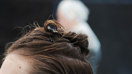Airtouch color technique. Hairdresser using hair clippers.