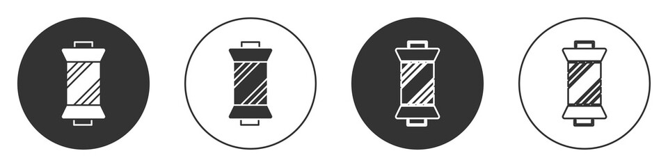 Black Sewing thread on spool icon isolated on white background. Yarn spool. Thread bobbin. Circle button. Vector