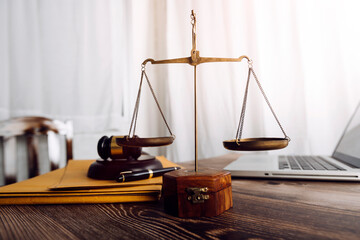 justice and law concept.Male judge in a courtroom on wooden table and Counselor or Male lawyer...