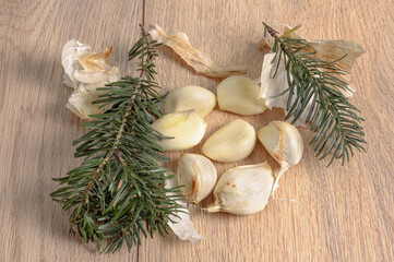 peeled garlic cloves and rosemary leaves