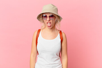 young pretty woman feeling disgusted and irritated and tongue out. summer tourist concept