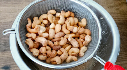 Closeup of salty roasted cashews ready to eat