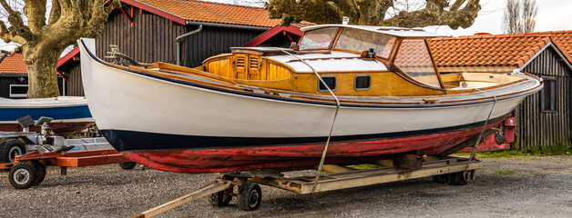Fototapeta na wymiar A pinasse, a wooden boat typical of the Arcachon Bay, on a dry dock