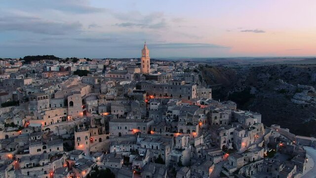 sassi di matera aerial view drone at dawn,old city downtown illuminated at sunrise famous travel destination italy