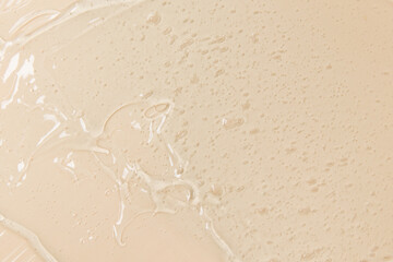 Abstract cosmetic background from transparent gel or antiseptic, hyaluron