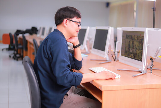 A student sitting in a computer room at the university