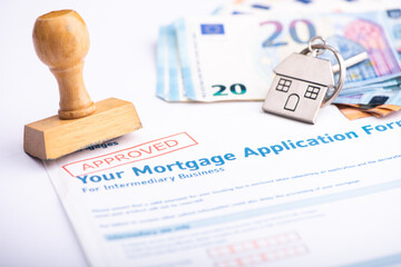 Approved Mortgage loan application with rubber stamp