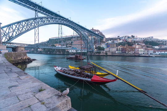Portugal, Porto, Rabelo boats on Douro river with Dom Lus I Bridge in background
