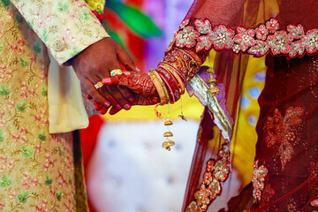 Indian couple hand in wedding Satphera ceremony in hinduism