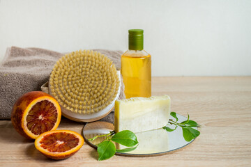 Obraz na płótnie Canvas Ecologic concept. Spa still life with essential oil, hand made soap and dry massage brush. Zero waste products for personal care