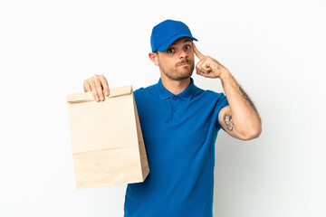 Brazilian taking a bag of takeaway food isolated on white background thinking an idea