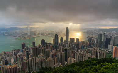 Hong Kong city skyline from Victoria peak, China with dramatic sky.