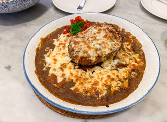 Japanese hamburg curry rice with mozzarella cheese - close up