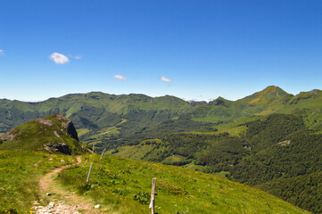 a hiking trail with a magnificent view with volcanic mountains in a national park in a wild region,...
