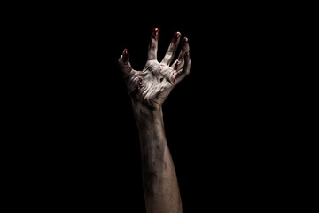 Creepy bloody zombie hand over dark background with clipping path. Horror and Halloween theme. - obrazy, fototapety, plakaty