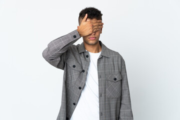 Young brazilian man isolated on white background covering eyes by hands. Do not want to see...