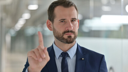 Portrait of Middle Aged Businessman with Pointing with Finger and Inviting 