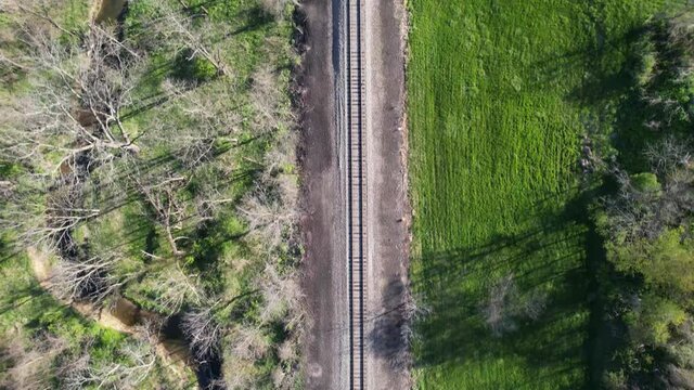 aerial, aerial view, drone video, drone view, environment, forest, grass, green, line, natural, nature, old, outdoor, overhead view, rail, railroad, railroad track, railway, railways, road, rural, spr