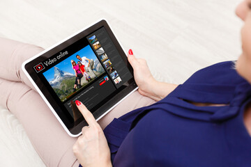 Man watching videos online on tablet