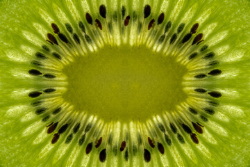 Black seeds inside a Fresh and Healthy Green Kiwi.