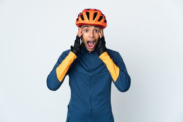 Young cyclist Brazilian man isolated on white background with surprise expression - obrazy, fototapety, plakaty