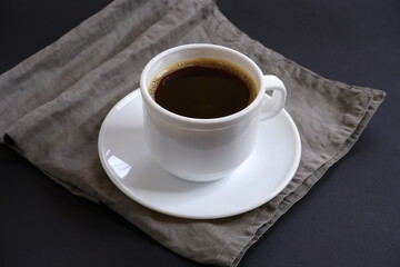 Black coffee  on a black background.