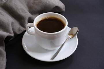 Black coffee on a black background.