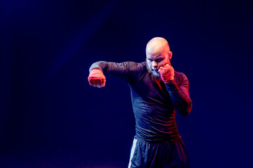 Sportsman boxer fighting on black background, Boxing sport conce