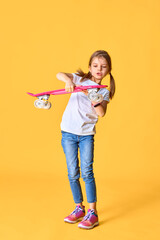 Stylish funny girl wearing white t-shirt, blue jeans and sneaker