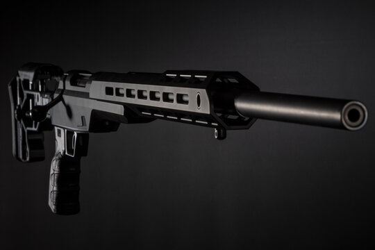 black sniper carbine on a dark background