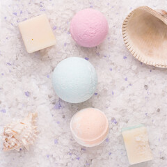 Bathroom products. Bath bombs on the texture of sea salt. View from above