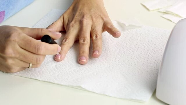 Manicure with led lamp in process. Closeup