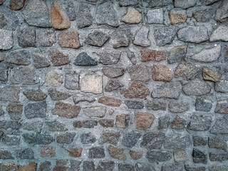 Stone wall, made of large stones of different shapes