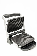 electric grill with open lid. appliance for cooking in everyday life. Made of stainless steel, special non-stick coating. healthy food. food without oil and fat. 