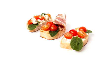 Three bruschetta on a ciabatta on a white plate. Italian appetizer