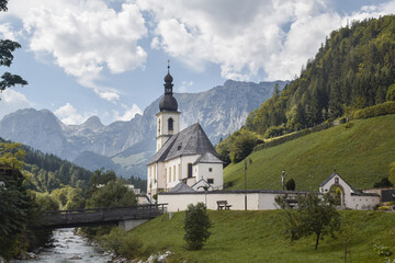 Fototapeta na wymiar church in forest with river in bavaria