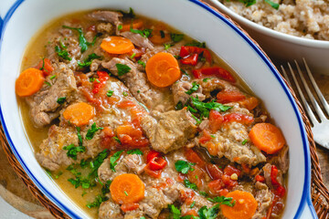 Beef stew in gravy with vegetables. Meat goulash