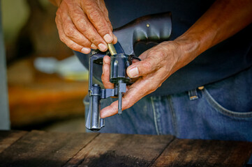 Gun with ammunition on black background,ammunition selective focus 